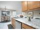 Bright kitchen with a double sink, stainless steel appliances, a dining area, and natural light at 646 Lakes Cir, Lithonia, GA 30058