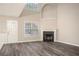 Living room features a fireplace and lots of natural light at 646 Lakes Cir, Lithonia, GA 30058