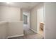 Upstairs hallway with carpet and doors to bedrooms and bath at 646 Lakes Cir, Lithonia, GA 30058