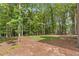 Expansive backyard featuring lush greenery and manicured lawn, ideal for outdoor activities and relaxation at 135 Cedarwood Ln, Roswell, GA 30075
