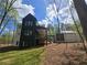 Expansive backyard featuring a lush green lawn and wooded privacy at 135 Cedarwood Ln, Roswell, GA 30075