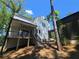 Back of house showing the large deck, perfect for entertaining at 135 Cedarwood Ln, Roswell, GA 30075