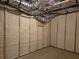 Unfinished basement with spray foam insulation and framed walls at 135 Cedarwood Ln, Roswell, GA 30075