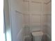 Small bathroom with a toilet and wainscoting at 135 Cedarwood Ln, Roswell, GA 30075