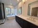 Elegant bathroom featuring a soaking tub, double vanity, and walk-in shower at 135 Cedarwood Ln, Roswell, GA 30075