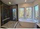 Luxurious bathroom with soaking tub and walk-in shower at 135 Cedarwood Ln, Roswell, GA 30075