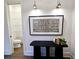 Chic powder room features wainscoting, a modern toilet, and stylish fixtures, providing convenience and elegance at 135 Cedarwood Ln, Roswell, GA 30075