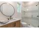 Modern bathroom showcasing a glass-enclosed shower, stylish fixtures, and sleek design elements at 135 Cedarwood Ln, Roswell, GA 30075
