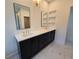 Double vanity bathroom with dark cabinetry and quartz countertops at 135 Cedarwood Ln, Roswell, GA 30075