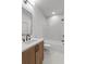 This spacious bathroom has a wood vanity and shower/bath combo at 135 Cedarwood Ln, Roswell, GA 30075
