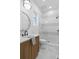 Modern bathroom featuring marble floors, tiled shower, and a sleek vanity at 135 Cedarwood Ln, Roswell, GA 30075