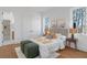 Bright bedroom with ensuite bath, large windows, and hardwood floors at 135 Cedarwood Ln, Roswell, GA 30075