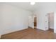 Bedroom featuring hardwood floors with an ensuite bathroom and closet view at 135 Cedarwood Ln, Roswell, GA 30075