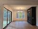 Sunlit dining area with hardwood floors, fireplace and sliding glass doors at 135 Cedarwood Ln, Roswell, GA 30075