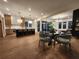 Dining area with stylish table, modern chairs, and seamless flow to open-concept kitchen and living room at 135 Cedarwood Ln, Roswell, GA 30075