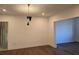 Spacious dining room with dark hardwood floors and modern light fixture at 135 Cedarwood Ln, Roswell, GA 30075