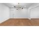 Dining room with modern chandelier and hardwood floors, providing a clean and modern design at 135 Cedarwood Ln, Roswell, GA 30075