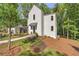 Stunning two-story home featuring a modern design and professional landscaping at 135 Cedarwood Ln, Roswell, GA 30075
