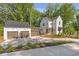 Attractive two-story home with a detached garage and ample parking space at 135 Cedarwood Ln, Roswell, GA 30075