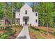 Charming two-story home with modern design and a landscaped front yard at 135 Cedarwood Ln, Roswell, GA 30075