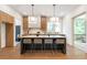 Elegant kitchen with large island, modern lighting, and stainless steel appliances perfect for cooking at 135 Cedarwood Ln, Roswell, GA 30075