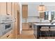 Gourmet kitchen features stainless steel appliances and a large center island at 135 Cedarwood Ln, Roswell, GA 30075