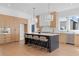 Bright, spacious kitchen featuring a large center island, stainless steel appliances, and custom cabinets at 135 Cedarwood Ln, Roswell, GA 30075