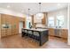 Spacious kitchen with large island, stainless steel appliances and stylish lighting, great for cooking at 135 Cedarwood Ln, Roswell, GA 30075