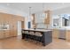 Stylish kitchen with an island, stainless steel appliances, and light wood cabinetry at 135 Cedarwood Ln, Roswell, GA 30075