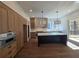 Modern kitchen with island, stainless steel appliances, and hardwood floors at 135 Cedarwood Ln, Roswell, GA 30075