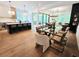 Open-concept layout with hardwood flooring connecting the kitchen, dining area and living room at 135 Cedarwood Ln, Roswell, GA 30075