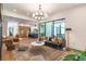 Spacious, open-concept living room with stylish furnishings and access to outdoor space at 135 Cedarwood Ln, Roswell, GA 30075