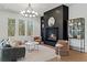 Bright living room featuring a modern fireplace, ample natural light, and elegant decor at 135 Cedarwood Ln, Roswell, GA 30075