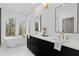 Bright main bathroom featuring soaking tub, double vanity, and natural light at 135 Cedarwood Ln, Roswell, GA 30075