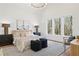 Bright main bedroom featuring hardwood floors, vaulted ceiling, natural light, and neutral decor at 135 Cedarwood Ln, Roswell, GA 30075