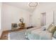 Main bedroom showcasing sitting area, decor, and a view into the hallway at 135 Cedarwood Ln, Roswell, GA 30075