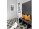 Mudroom featuring a geometric tiled floor, built-in bench with shiplap accent wall, and exterior door at 135 Cedarwood Ln, Roswell, GA 30075