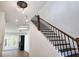 Modern staircase with dark wood and metal accents at 135 Cedarwood Ln, Roswell, GA 30075