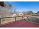 Beautiful backyard view from a wood deck showcasing a spacious lawn with mature trees and landscaping at 1515 Bullard Pl, Powder Springs, GA 30127