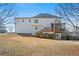 Expansive backyard view featuring a spacious lawn and a charming screened-in porch, perfect for outdoor entertaining at 1515 Bullard Pl, Powder Springs, GA 30127