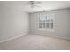 Bright and airy bedroom with large windows and neutral color palette at 1515 Bullard Pl, Powder Springs, GA 30127