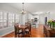 Cozy dining area featuring hardwood floors, natural light, and chandelier at 1515 Bullard Pl, Powder Springs, GA 30127