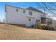 Rear exterior of the house featuring a multi-level deck and a well-manicured lawn, perfect for outdoor enjoyment at 1515 Bullard Pl, Powder Springs, GA 30127