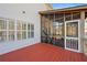 Exterior view of a screened porch with a painted wood floor, offering a relaxing outdoor space at 1515 Bullard Pl, Powder Springs, GA 30127