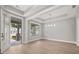 Spacious dining area with hardwood floors, chandelier, and entryway view at 320 Sobeck Way, Canton, GA 30115