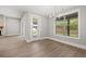 Bright dining room with chandelier and access to the patio at 320 Sobeck Way, Canton, GA 30115