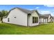 White house exterior showcasing a side view and patio at 320 Sobeck Way, Canton, GA 30115