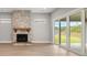 Living room with stone fireplace and sliding glass doors leading to the backyard at 320 Sobeck Way, Canton, GA 30115