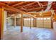 Unfinished basement with high ceilings and two garage doors at 4485 Coventry Ne Way, Roswell, GA 30075