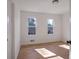 Bright bedroom with hardwood floors and two large windows at 4485 Coventry Ne Way, Roswell, GA 30075